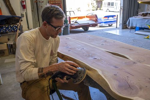 Craftsman Sanding Wood Slab