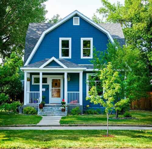 harming Blue House with Well-Kept Trees