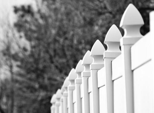 Classic White Picket Fence in Black and White