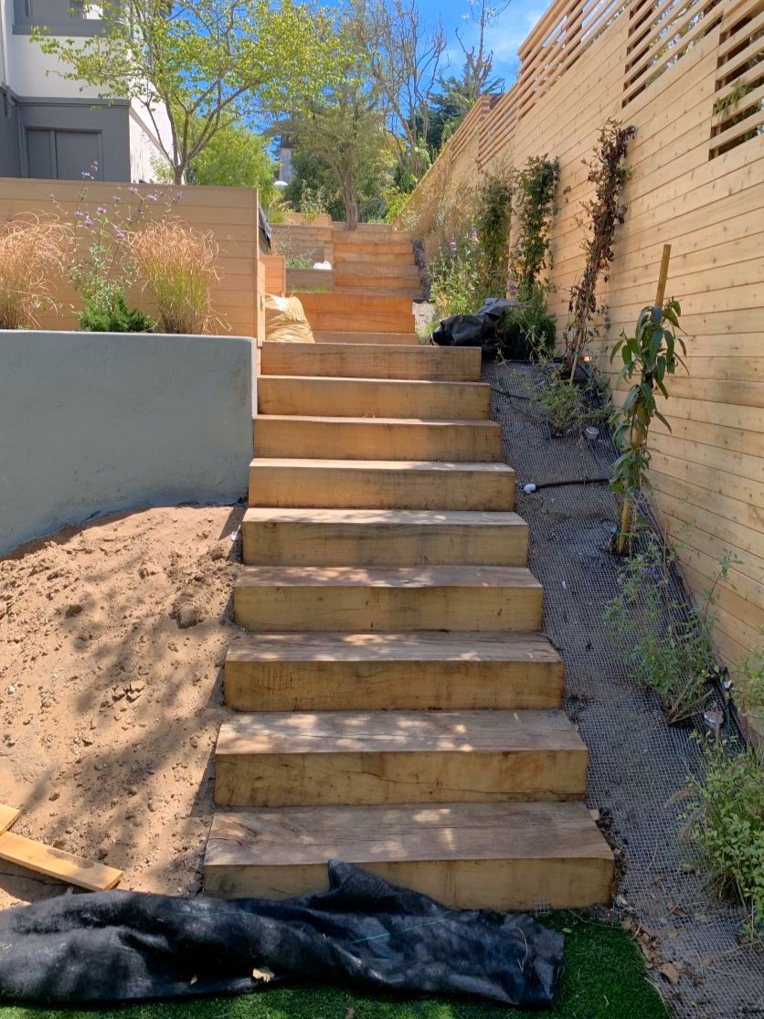 Custom residential wood staircase built from milled urban lumber by Arborist Now in San Francisco, showcasing handcrafted landscape and architectural wood features.
